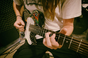 Awesome student playing guitar