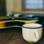 Guitar and coffee cup